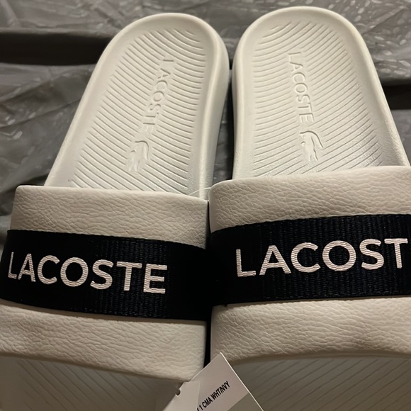 NWT ?Lacoste? slides size 11. Plastic with foam soles, leather upper, Nylon.